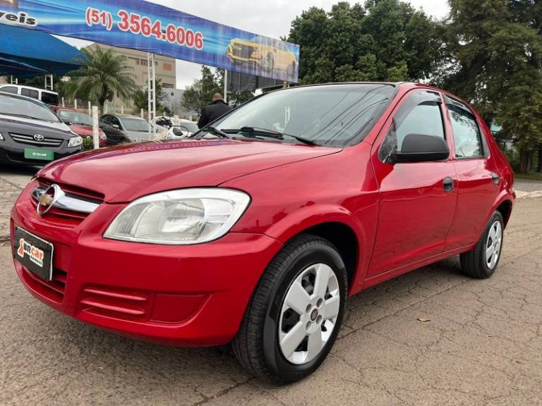 CHEVROLET - PRISMA - 2009/2010 - Vermelha - R$ 23.900,00